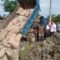 বড়লেখায় বন্যায় পচে যাওয়া ২৩৪ বস্তা চাল মাটি চাপা